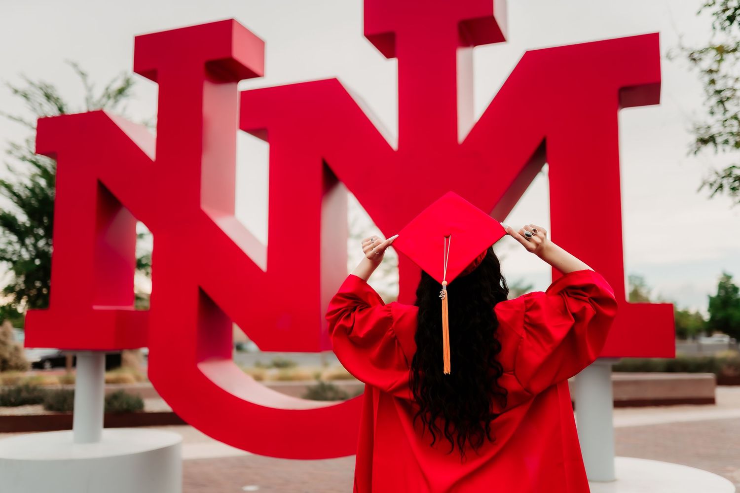 Large red letters spelling 'LOVE' appear to be breaking apart in a series of connected photographs.