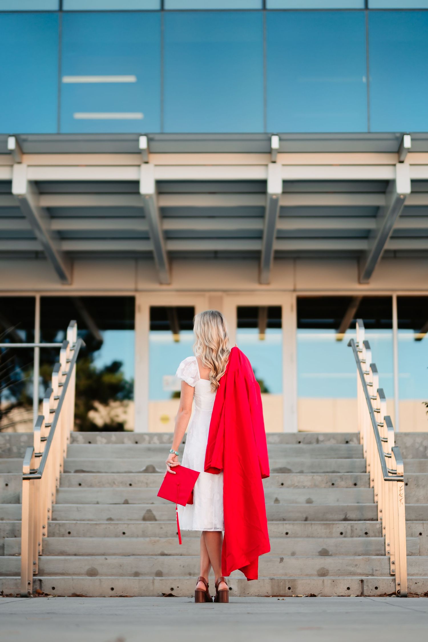 A sequence of photos showing a person in a red cape and white dress standing in empty stadium bleachers.