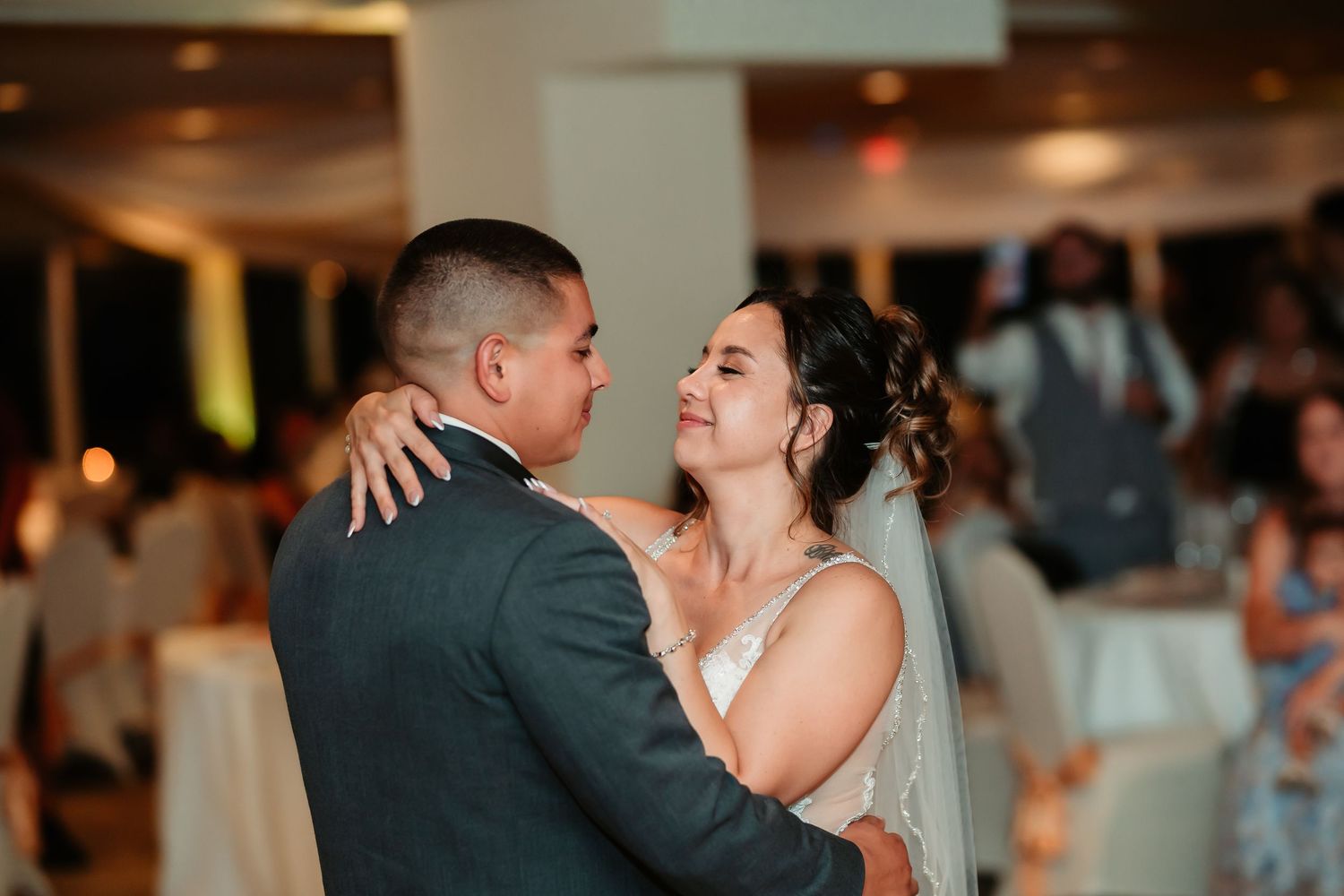 A romantic first dance between newlyweds at their wedding reception.