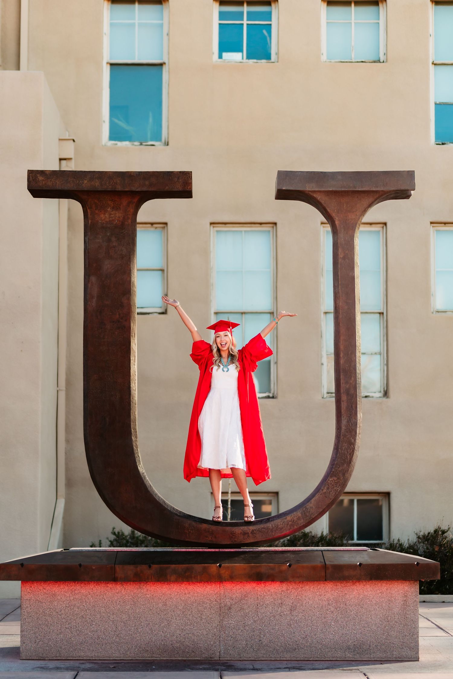 A sequence of photos showing a person in a red outfit posing with large metal letters mounted on a wall.