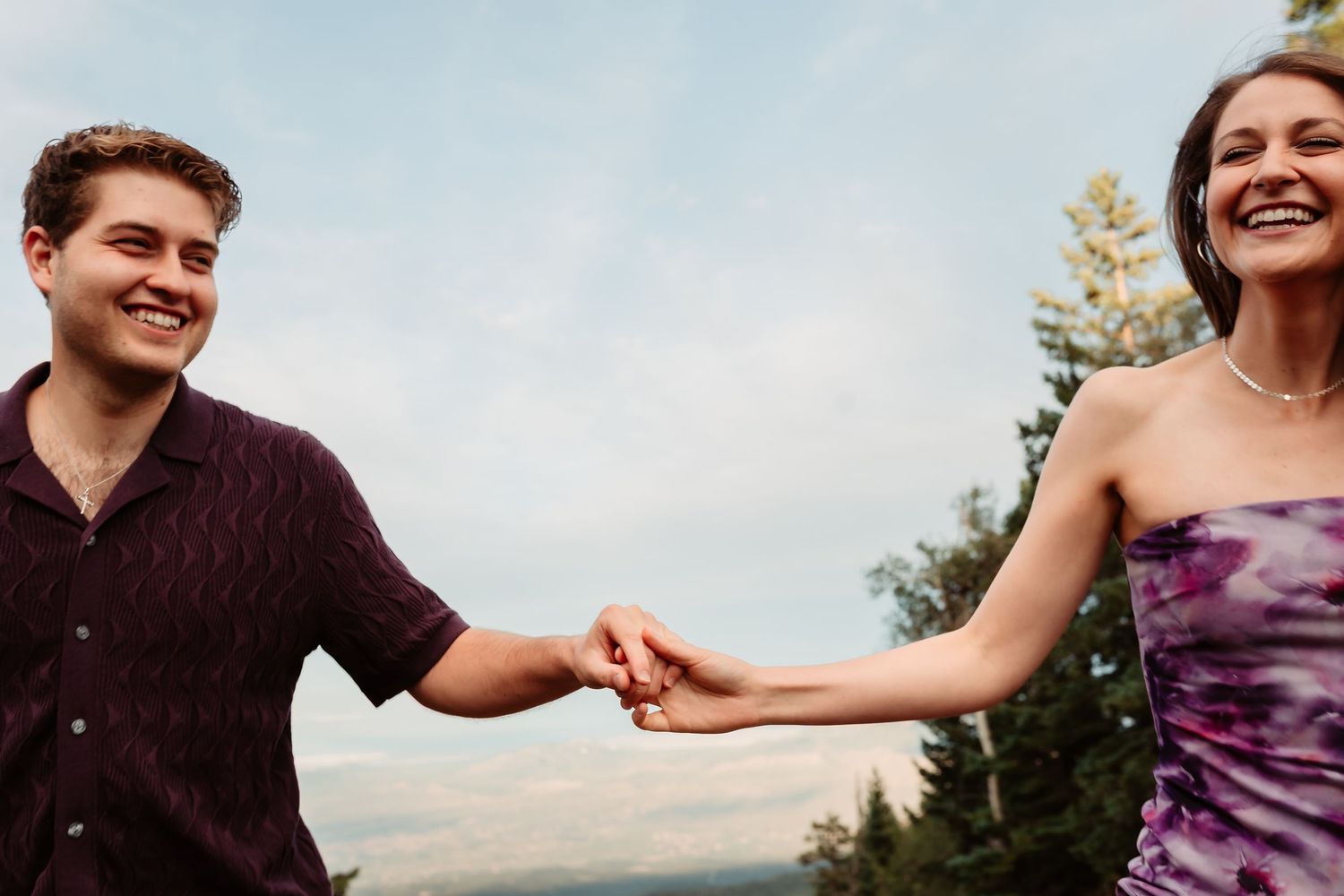 A series of five outdoor images showing joyful expressions and embraces against a natural landscape backdrop.