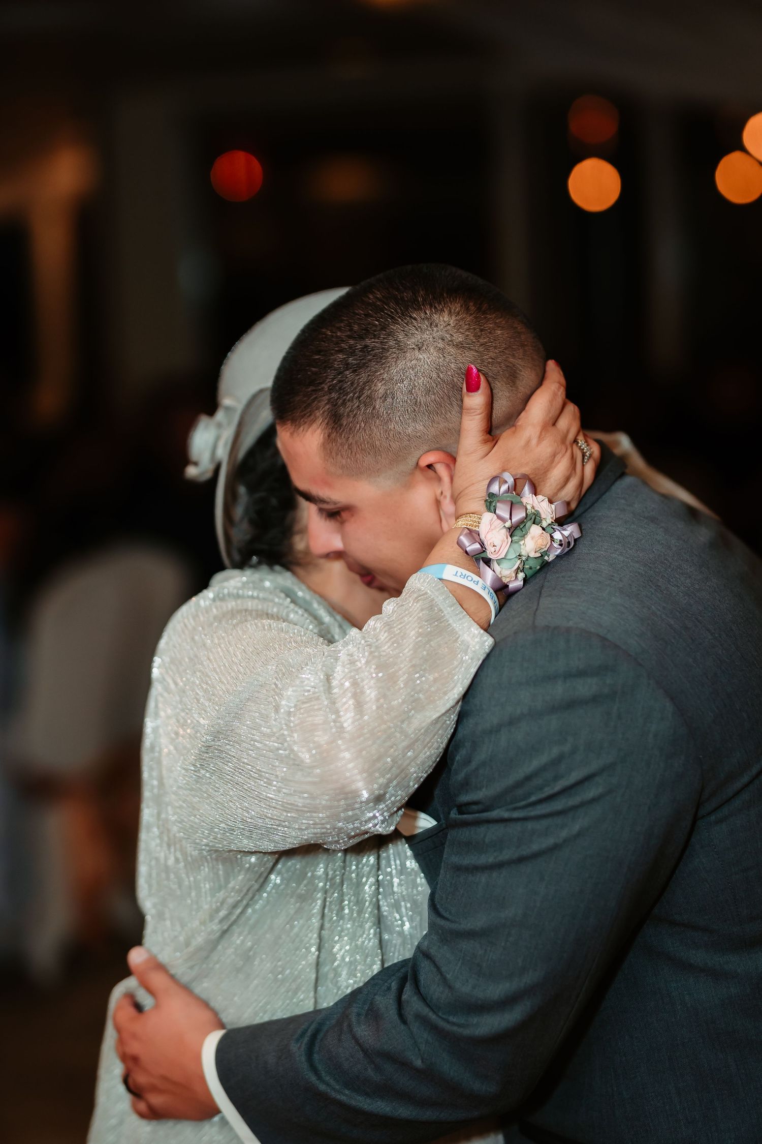 An intimate embrace between a couple during their wedding dance.