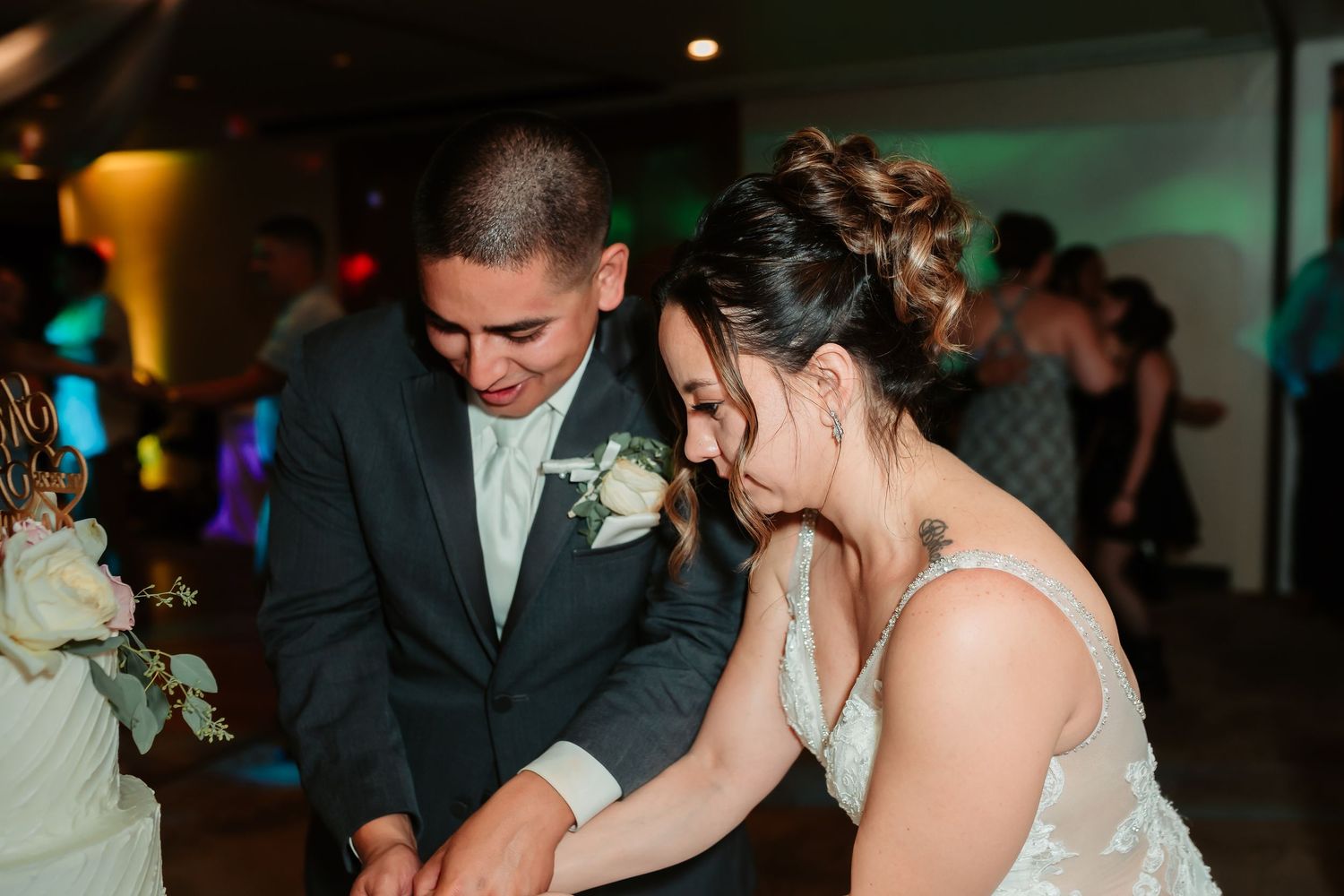 Couple shares an intimate moment during their wedding reception.