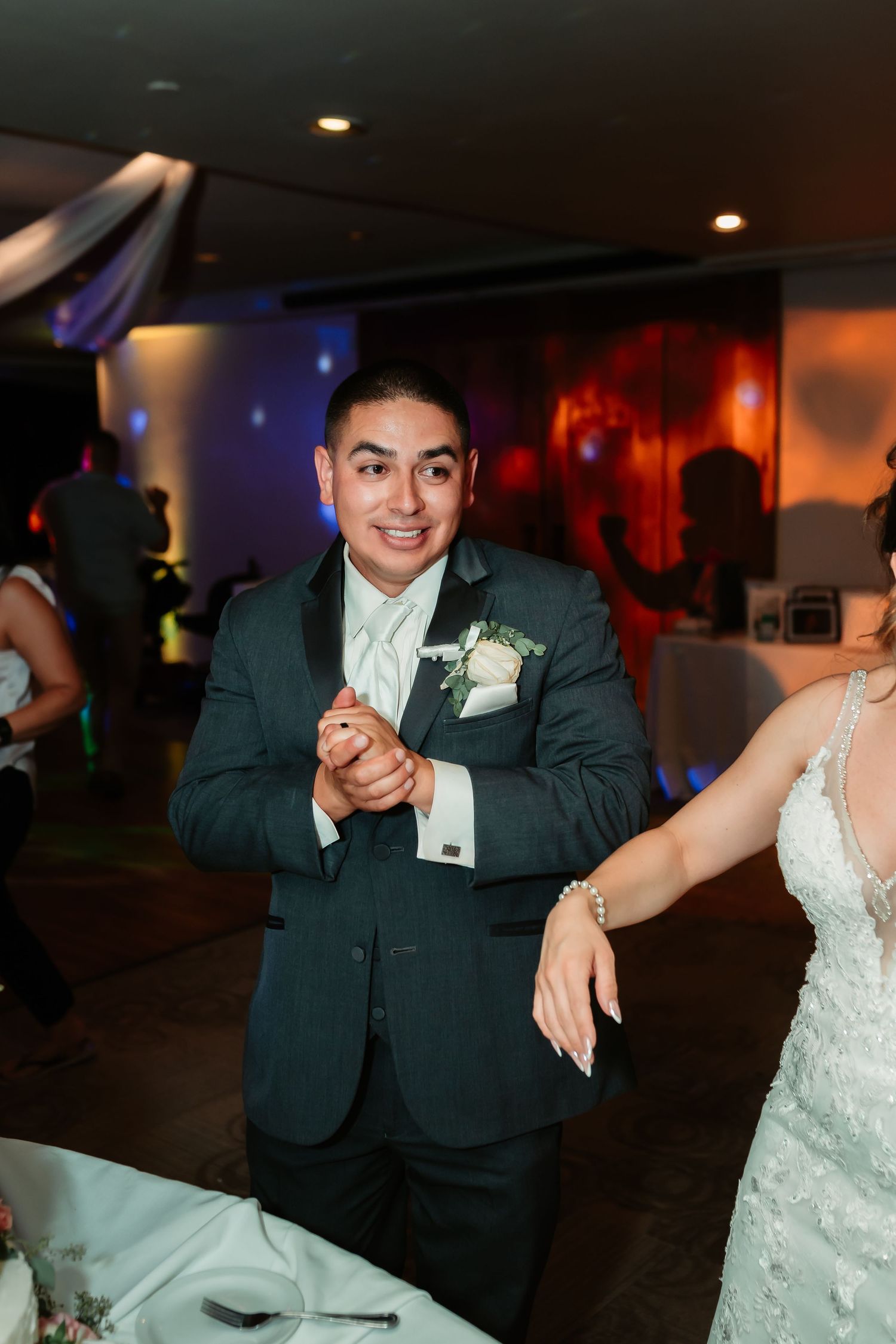 A couple performs a lively dance together during their wedding reception celebration.