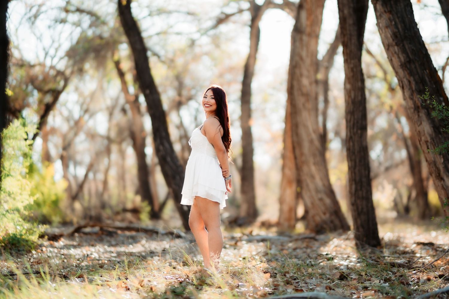 A collection of outdoor portraits taken in a wooded area with natural lighting and autumn trees.