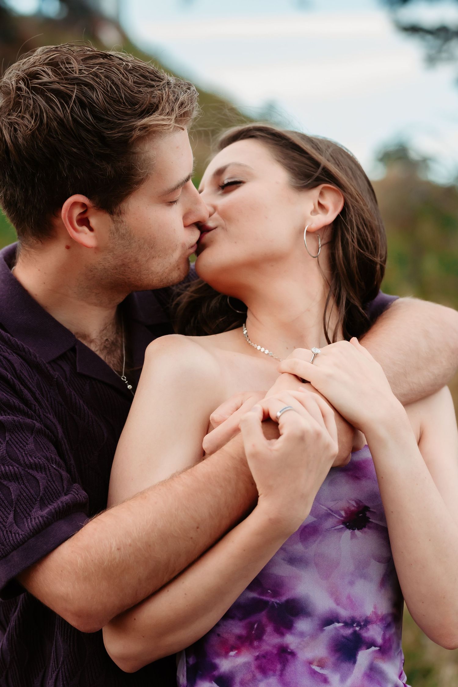 Close-up romantic moments captured against a natural mountain backdrop.