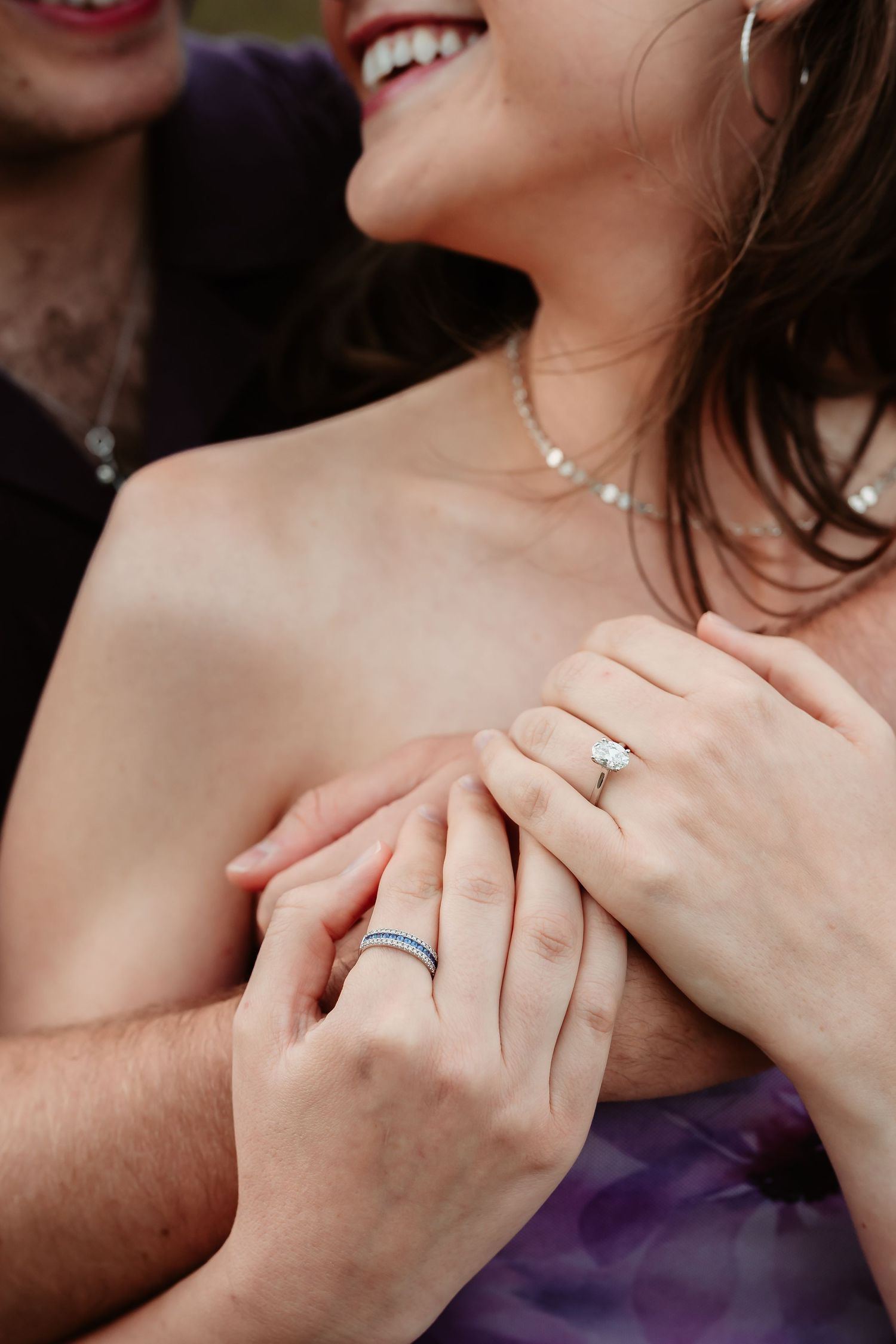 Close up shots of hands and jewelry highlighting an engagement ring against purple fabric.