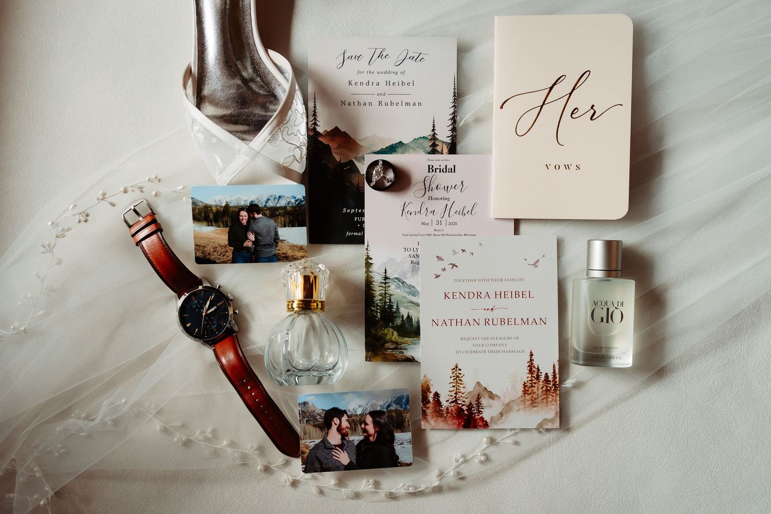 Romantic flatlay photo spread of wedding invitations, rings, and paper suite in neutral tones with calligraphy details.