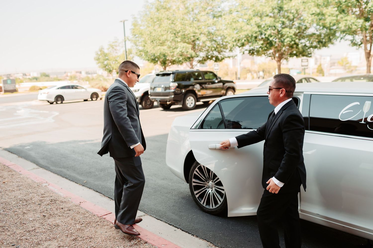 Wedding photography sequence showing groomsmen interacting near luxury cars outdoors.