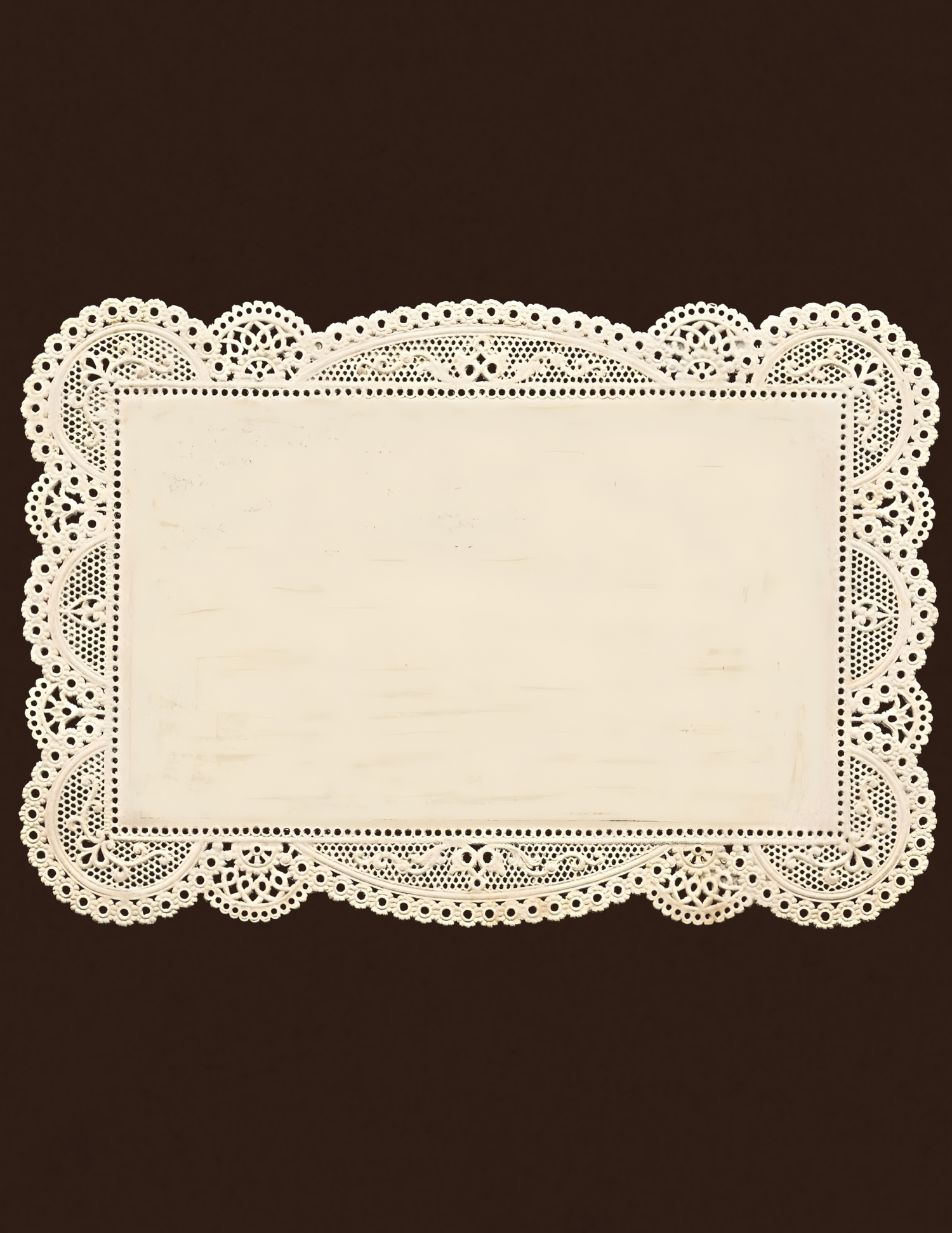 Elegant cream lace doily placemat with intricate floral border pattern on dark brown background.