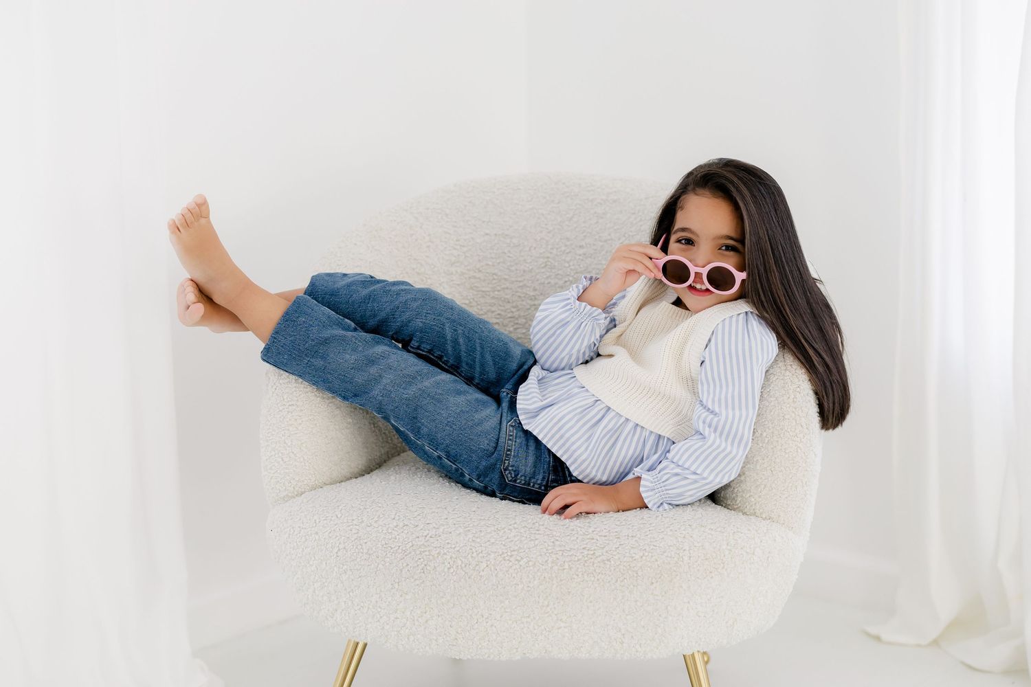 Person in light colored clothing lying down on white surface in various relaxed positions.