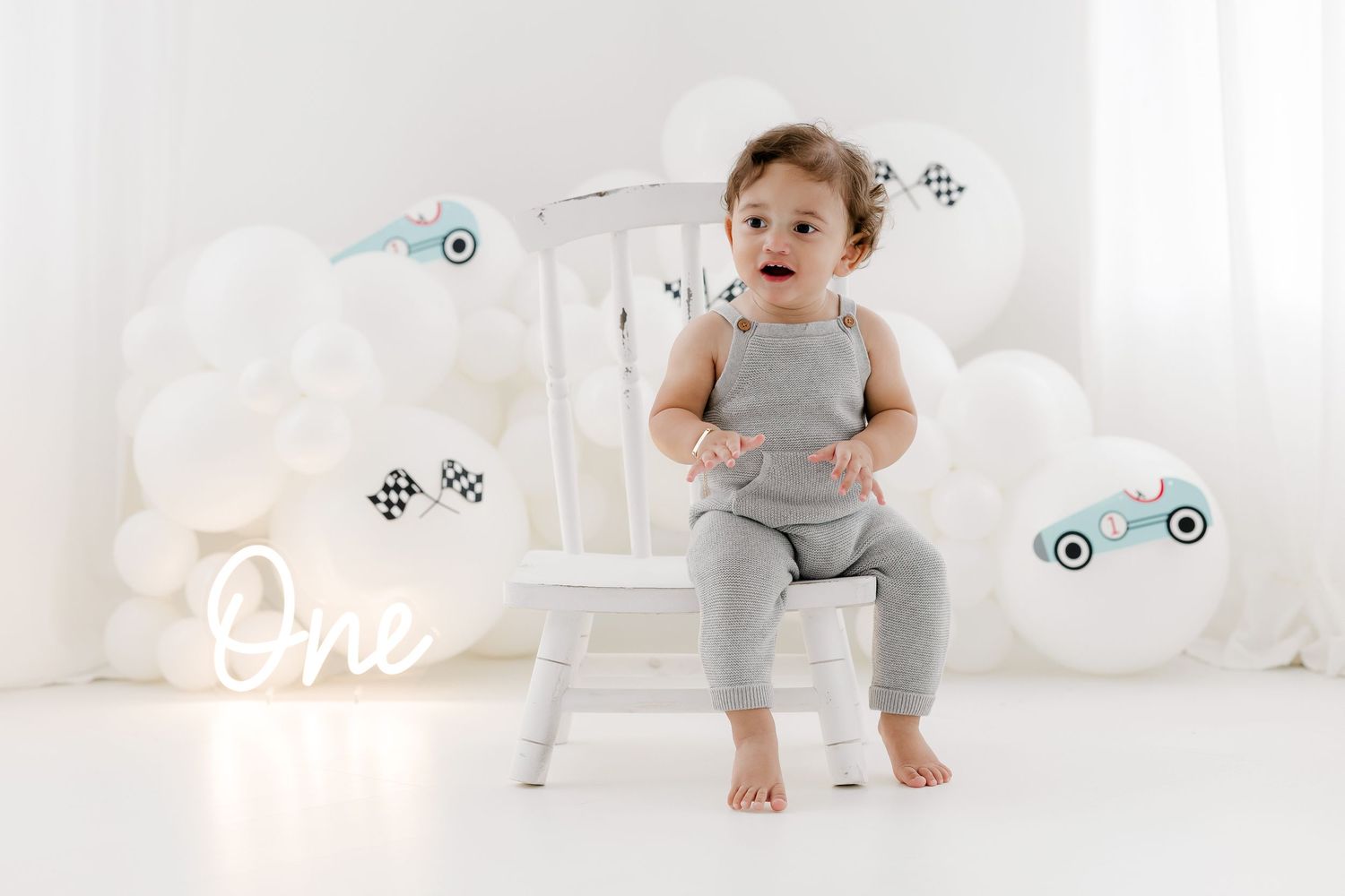 Series of white and gray studio portraits with soft lighting and modern minimalist styling.