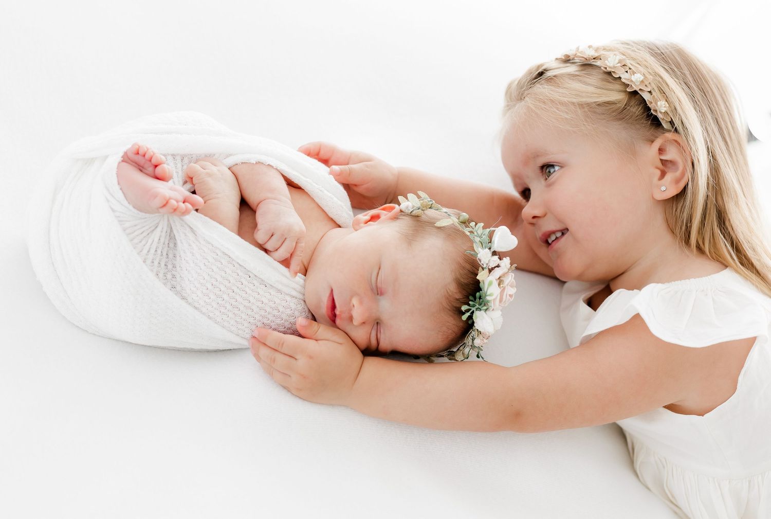 A series of sweet newborn baby photos showing sleeping positions and gentle interactions with parent.