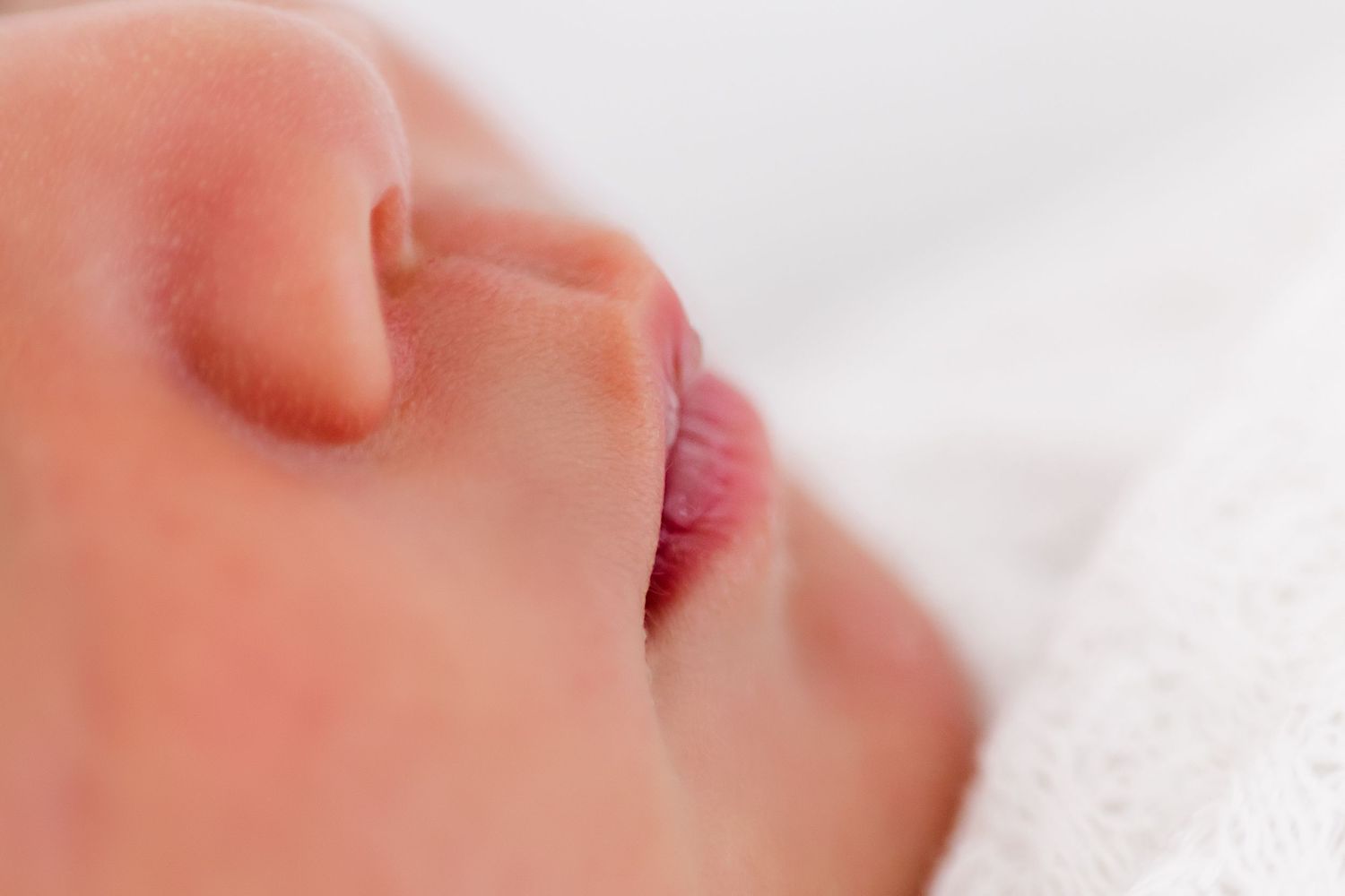 Close-up macro photos of baby skin showing soft texture and delicate features in a collage format.