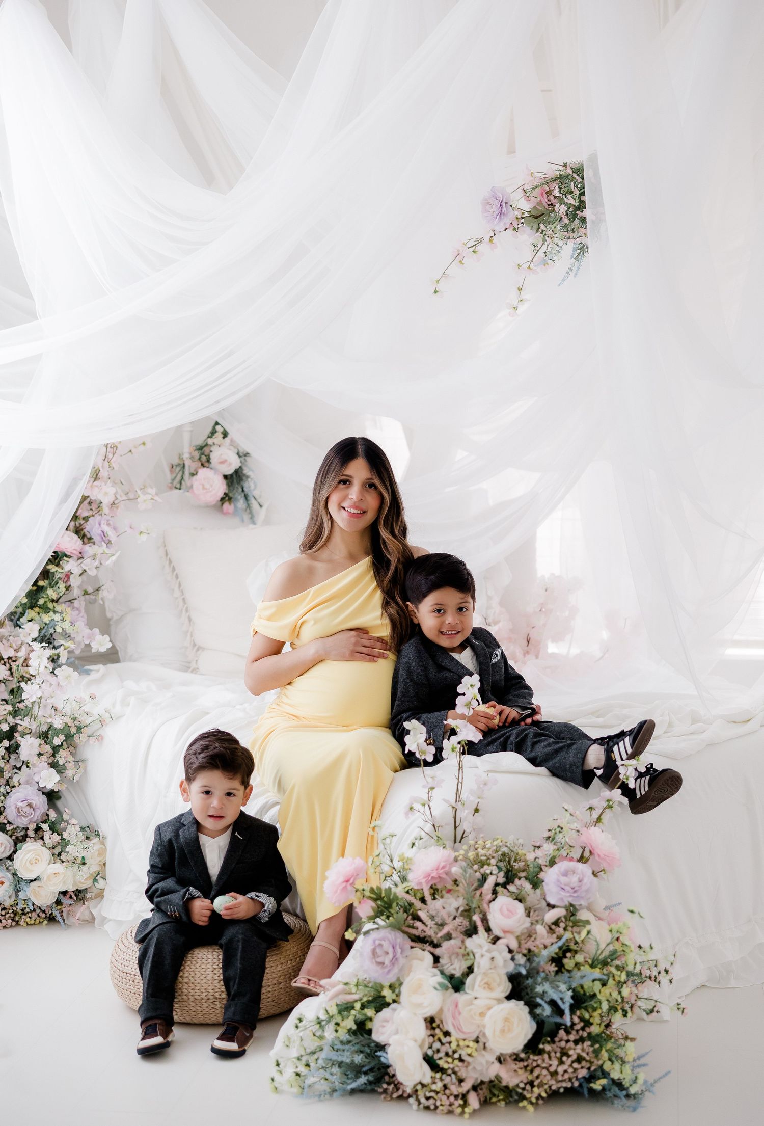 Three connected photos show a dreamy floral scene with white tulle draping, pink flowers, and elegant formal attire.