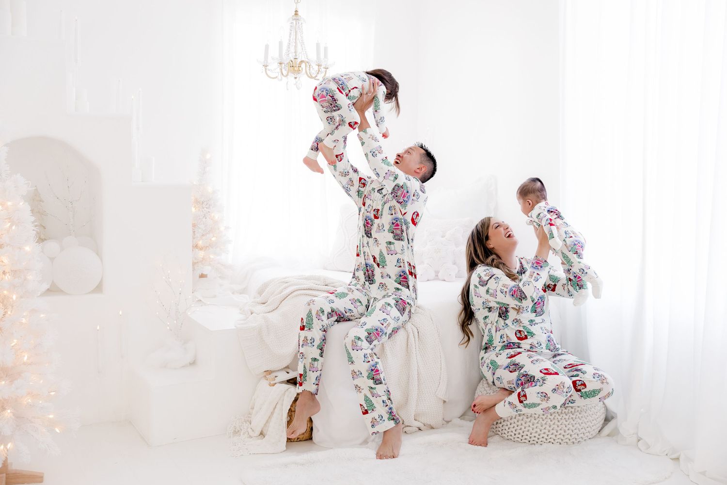 Sweet moments captured in white studio with floral outfits and soft lighting.nj holiday mini sessions