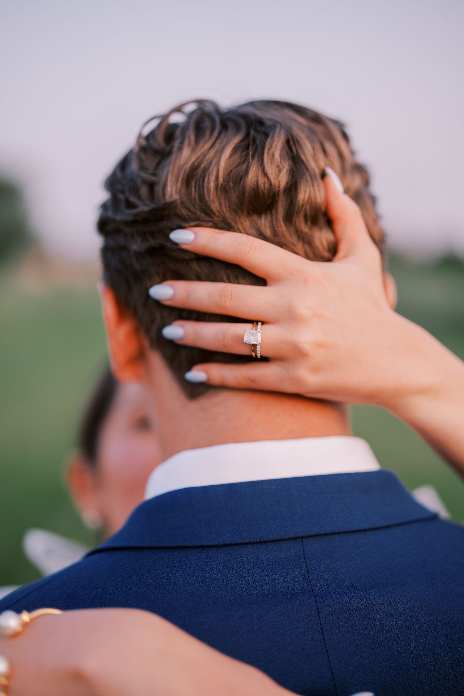Close-up series of romantic hand gestures between a couple with wedding ring visible against a soft blurred background.