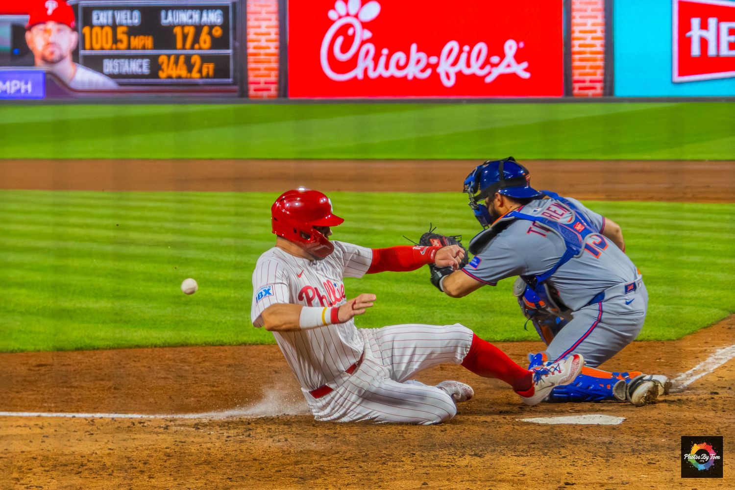 An image of Kyle Schwarber sliding.