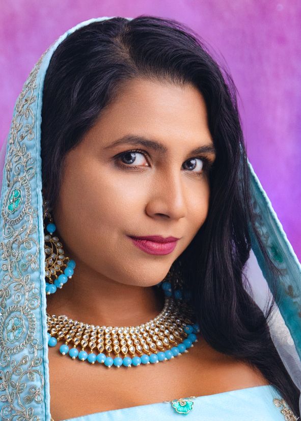 Traditional South Asian style portrait with turquoise dupatta and statement jewelry.