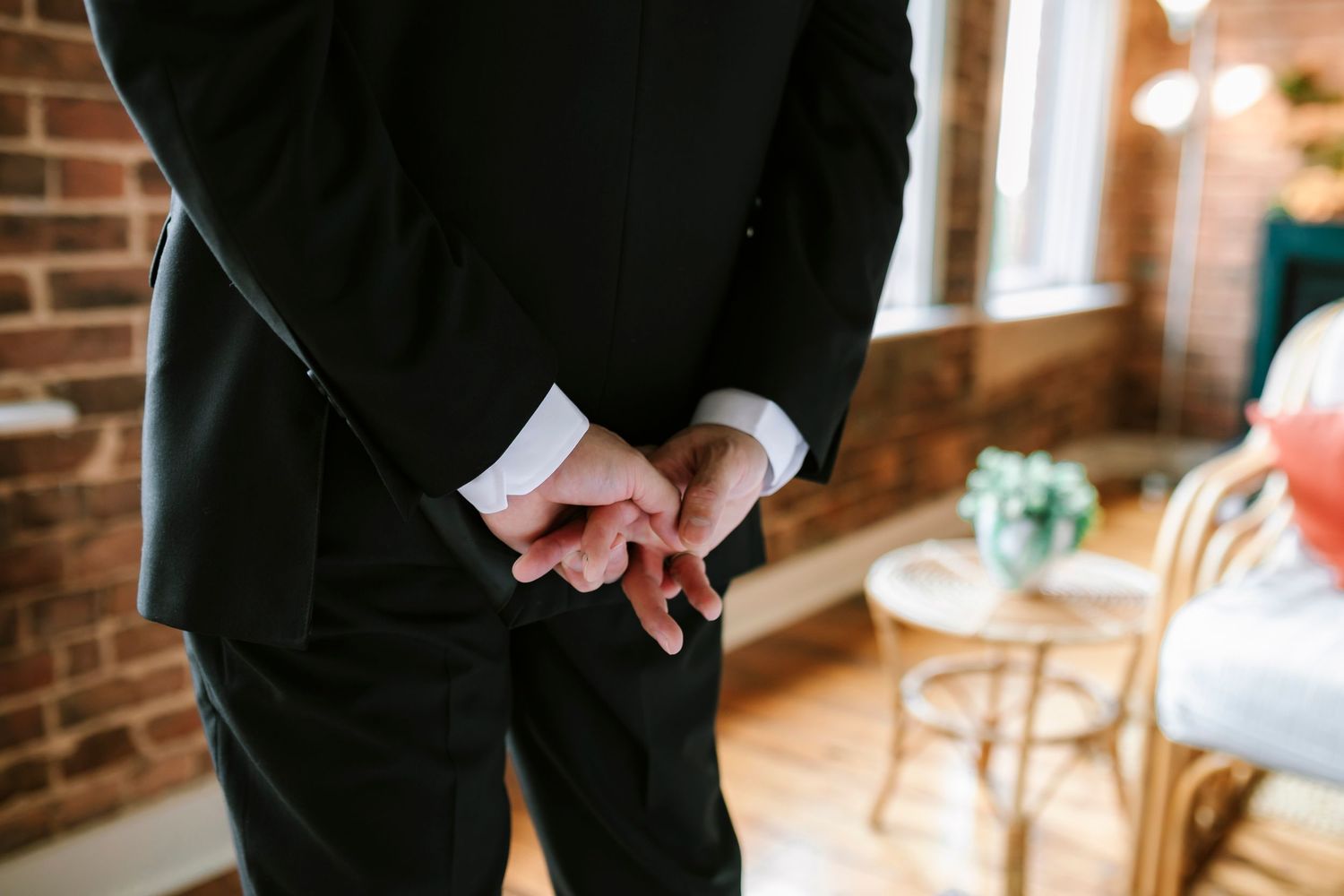 A groom waiting for his bride in a Springfield MO downtown AirBnb just before their wedding.