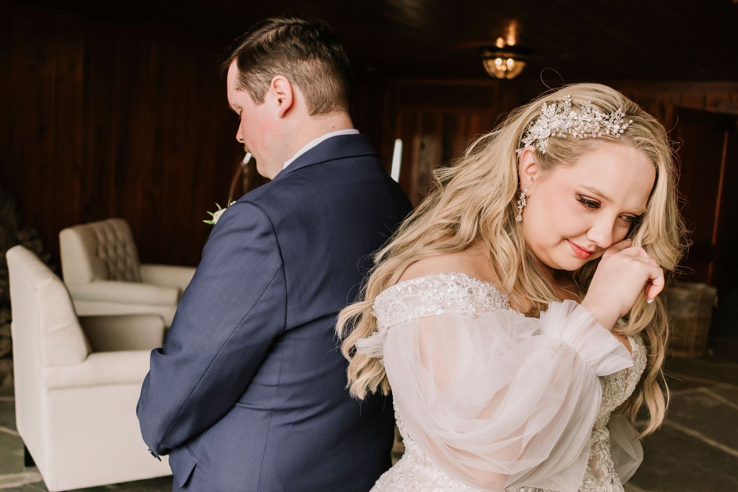 A romantic wedding couple shares intimate moments in a dimly lit Top of the Rock Chapel venue during their special celebration.