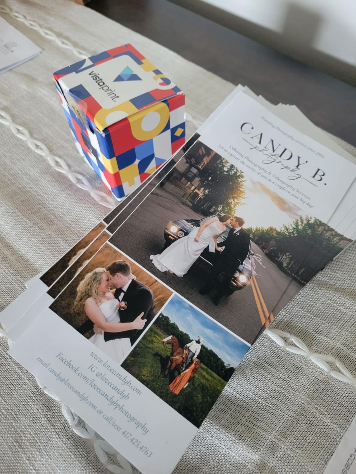 Photo collage of wedding stationery and invitation cards displayed with colorful geometric design elements on a textured surface.