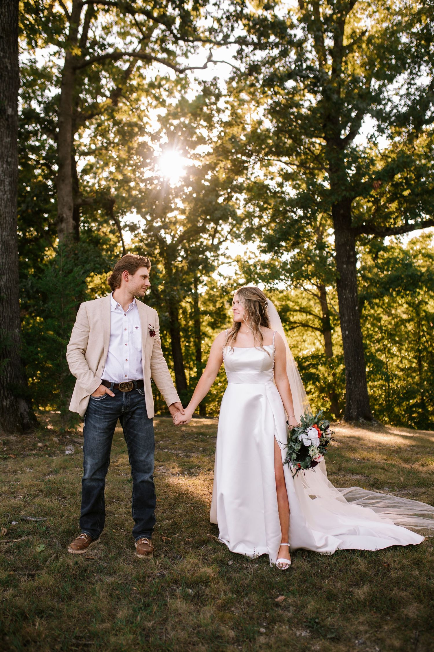 Bride and Groom holding hands after their first look at Seven Springs Winery in Linn Creek