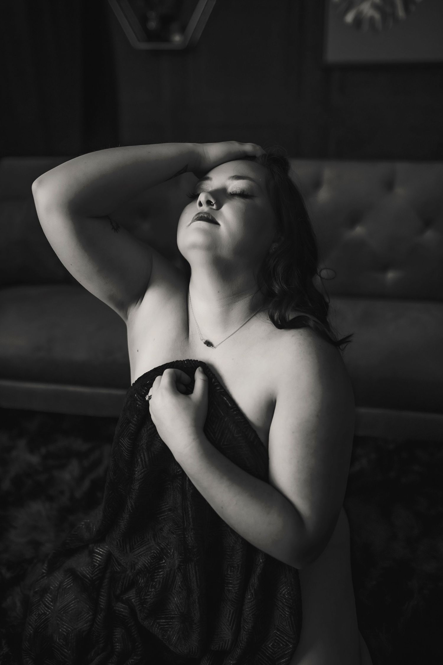 Artistic black and white photo series showing dramatic profile silhouettes with upturned faces against dark backgrounds.