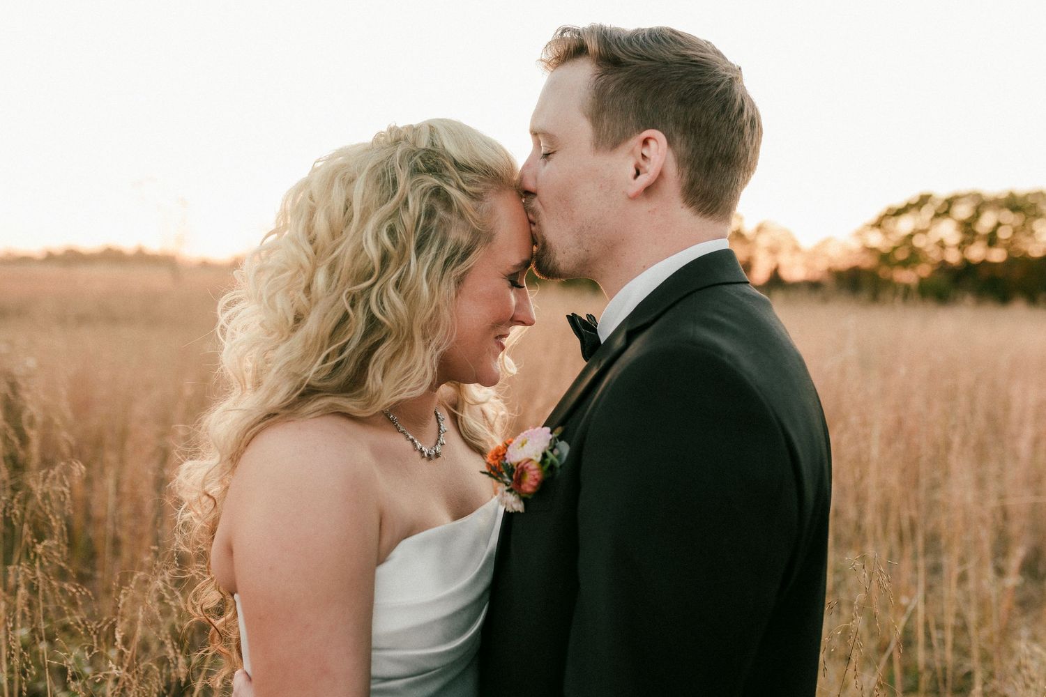 Couple shares romantic moments in golden light at sunset across six candid photos in an open field.