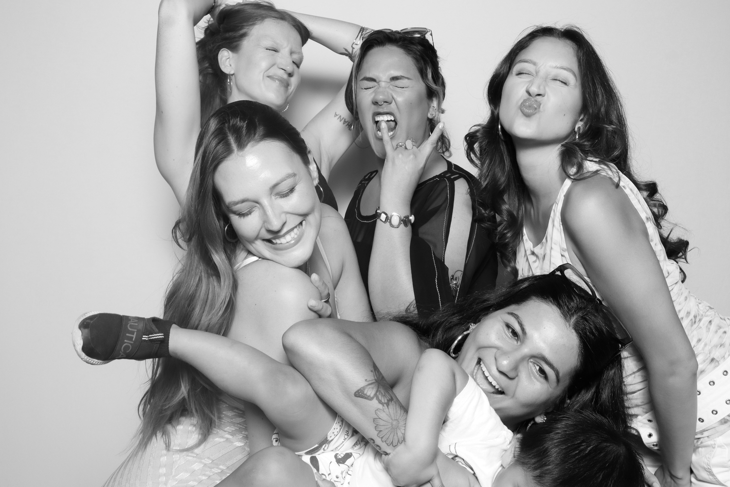 A group of women pose for a black and white photo