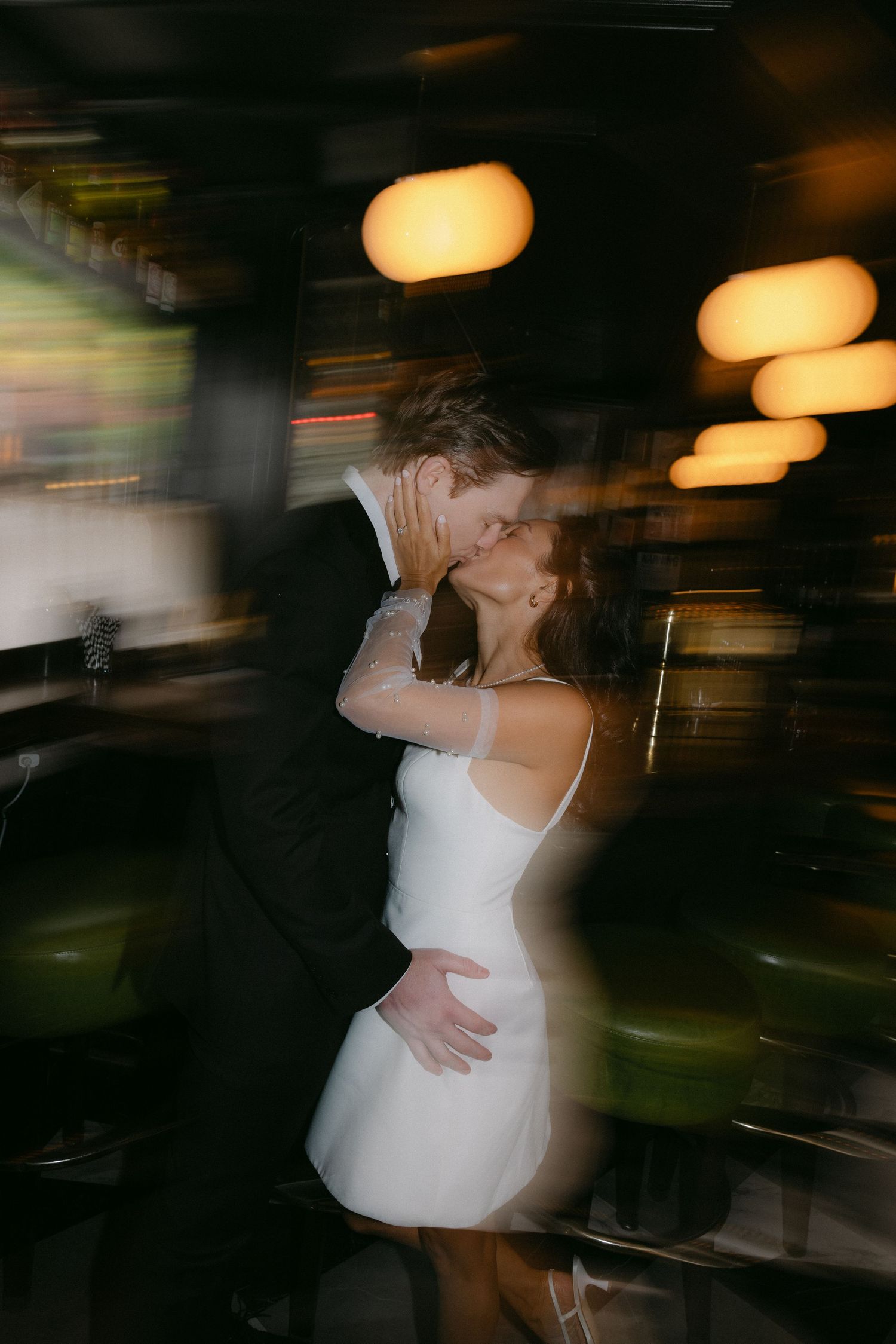 Motion blur wedding dance sequence with dramatic lighting.