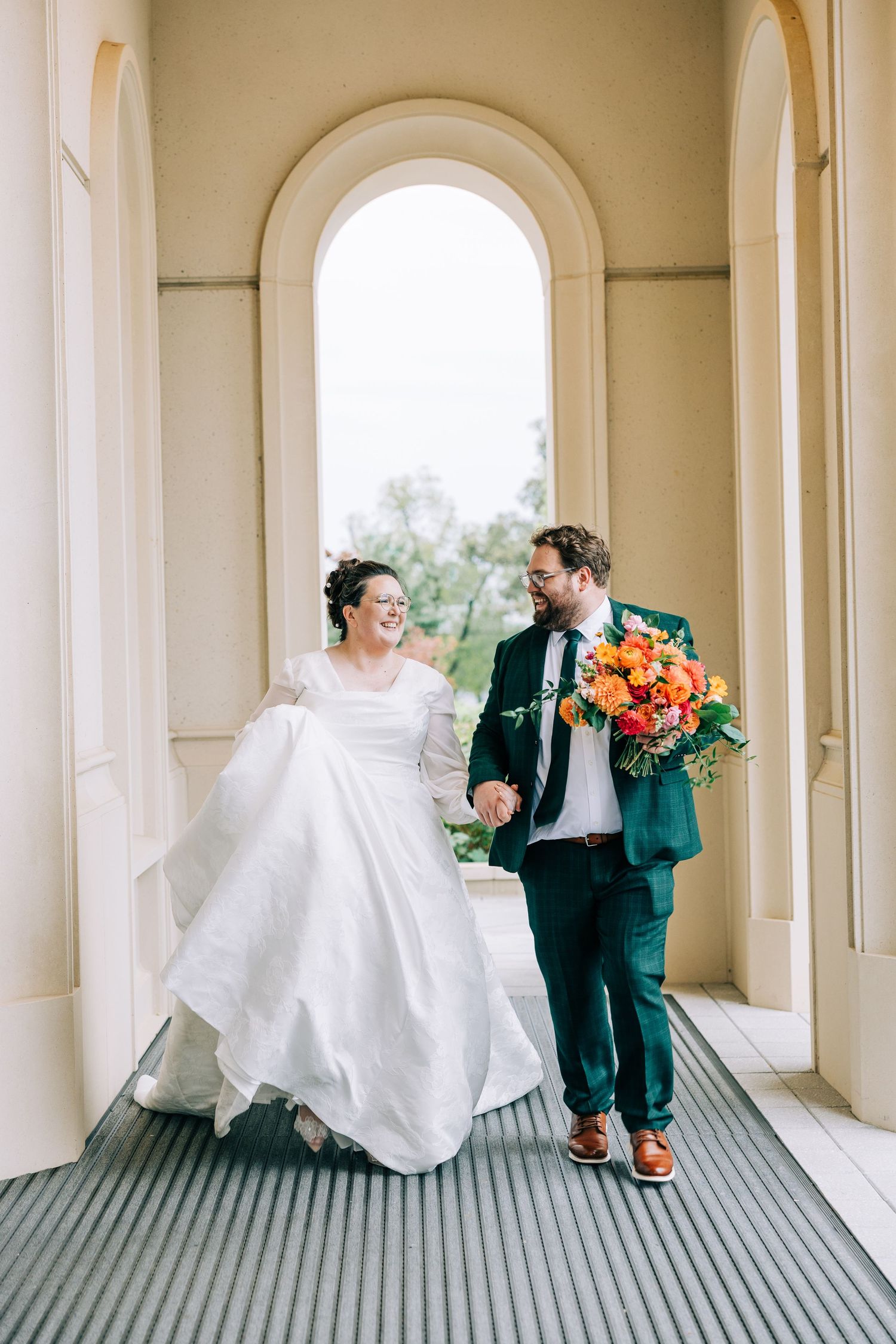 Sequence of wedding photos showing playful moments in an elegant arched hallway.