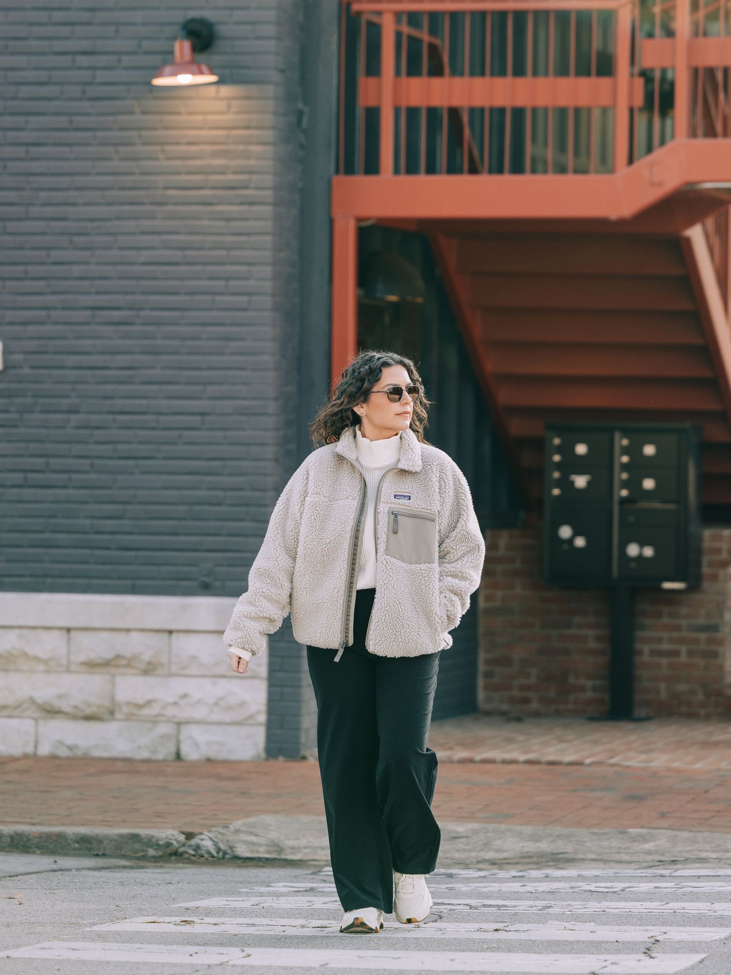A sequence of photos showing someone in a white shirt and dark pants crouching down on a brick sidewalk.