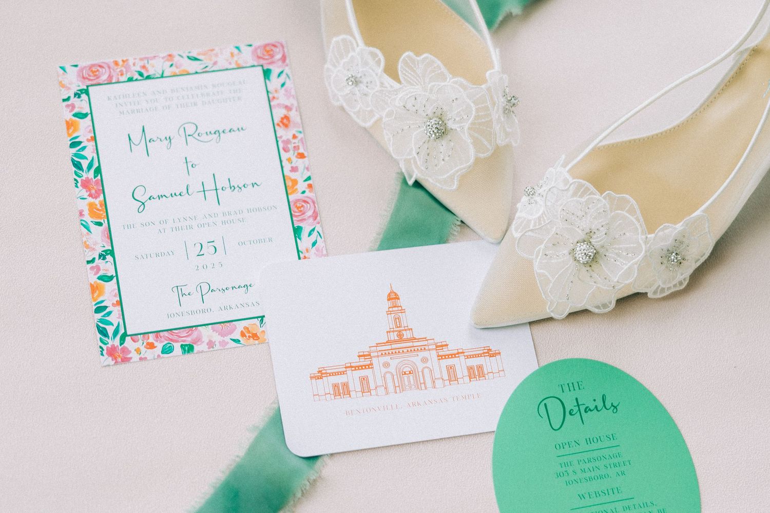 Wedding invitation suite featuring mint green and coral floral designs with elegant calligraphy and paper details.