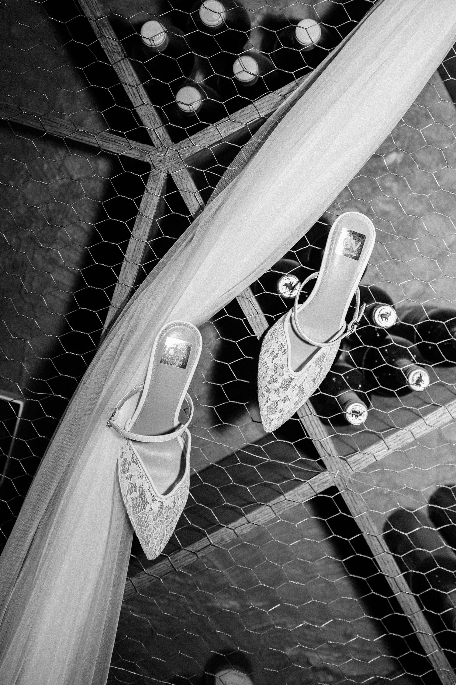 Black and white photo sequence showing a skateboard trick progression with feet landing on the board.