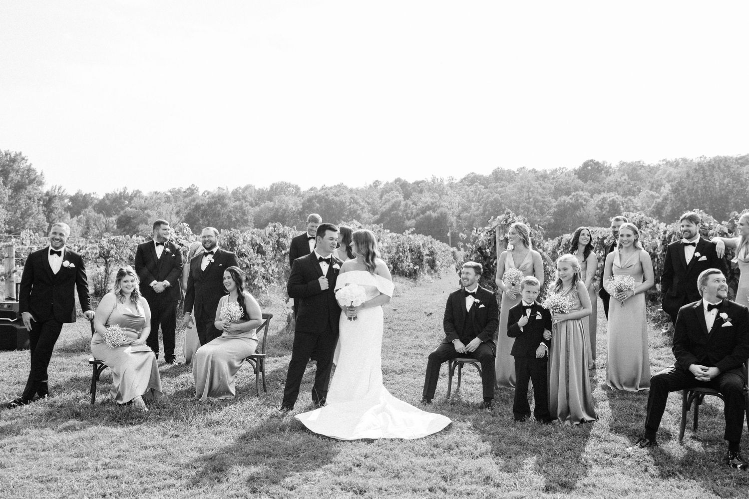 A black and white photo collage showing wedding party members posing together in an outdoor setting.