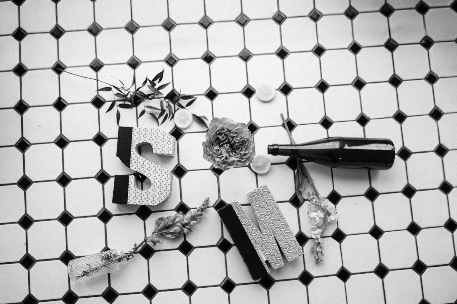 Black and white geometric tile pattern creating a modern minimalist backdrop.