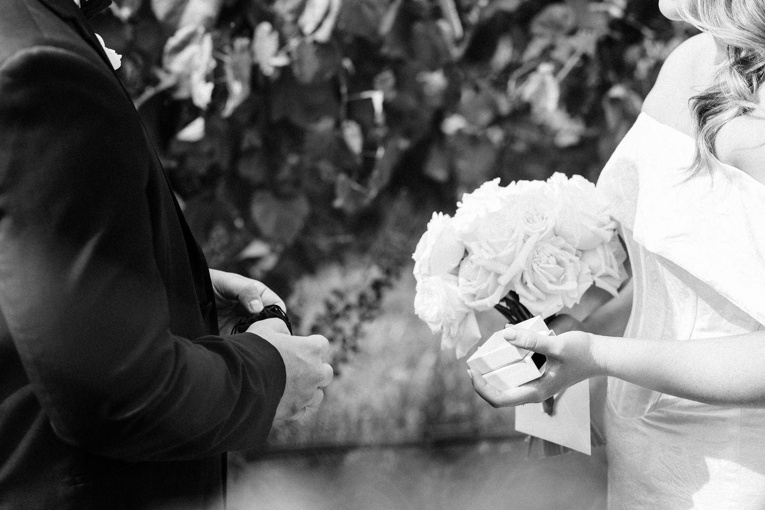 A black and white collage of wedding photos showing dancing, embraces, and celebration moments at a reception.