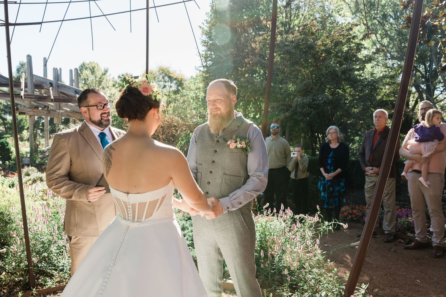 A collage of wedding moments shows dancing, embraces, and outdoor celebrations in a natural garden setting.