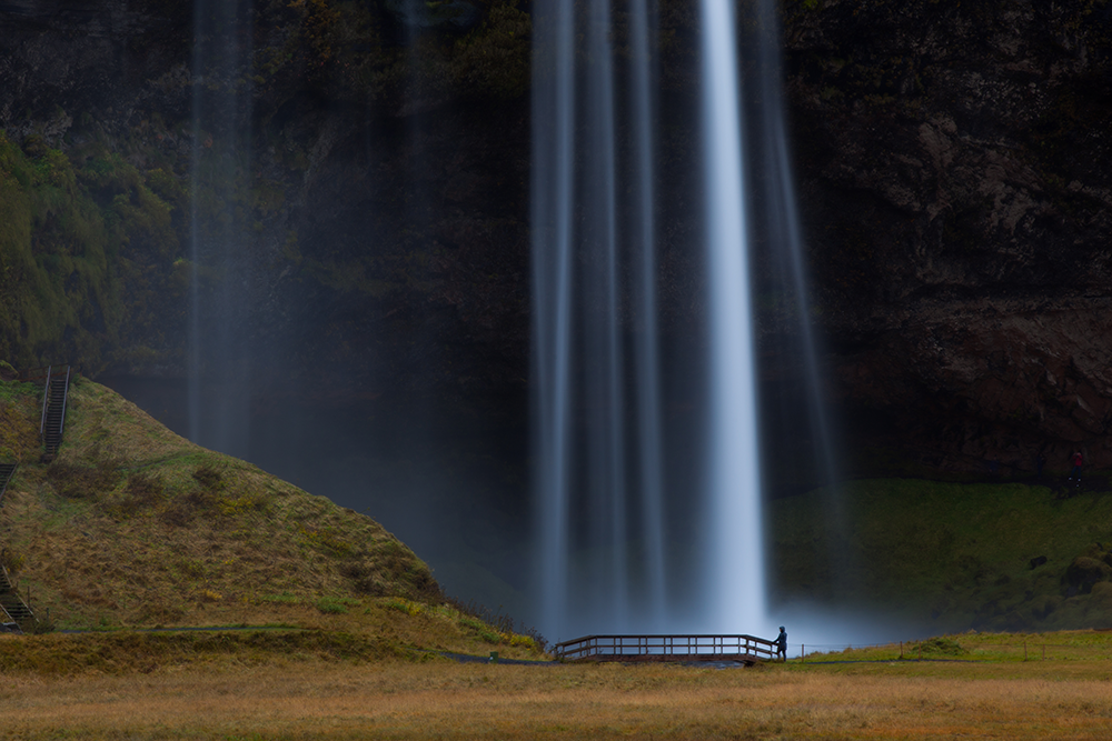 Waterfall with a bridge at the basin