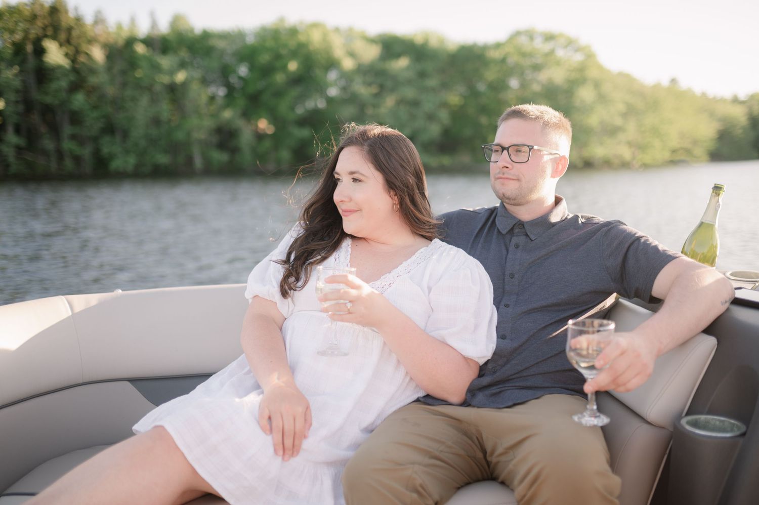 Romantic moment shared on a boat deck during a sunny afternoon.