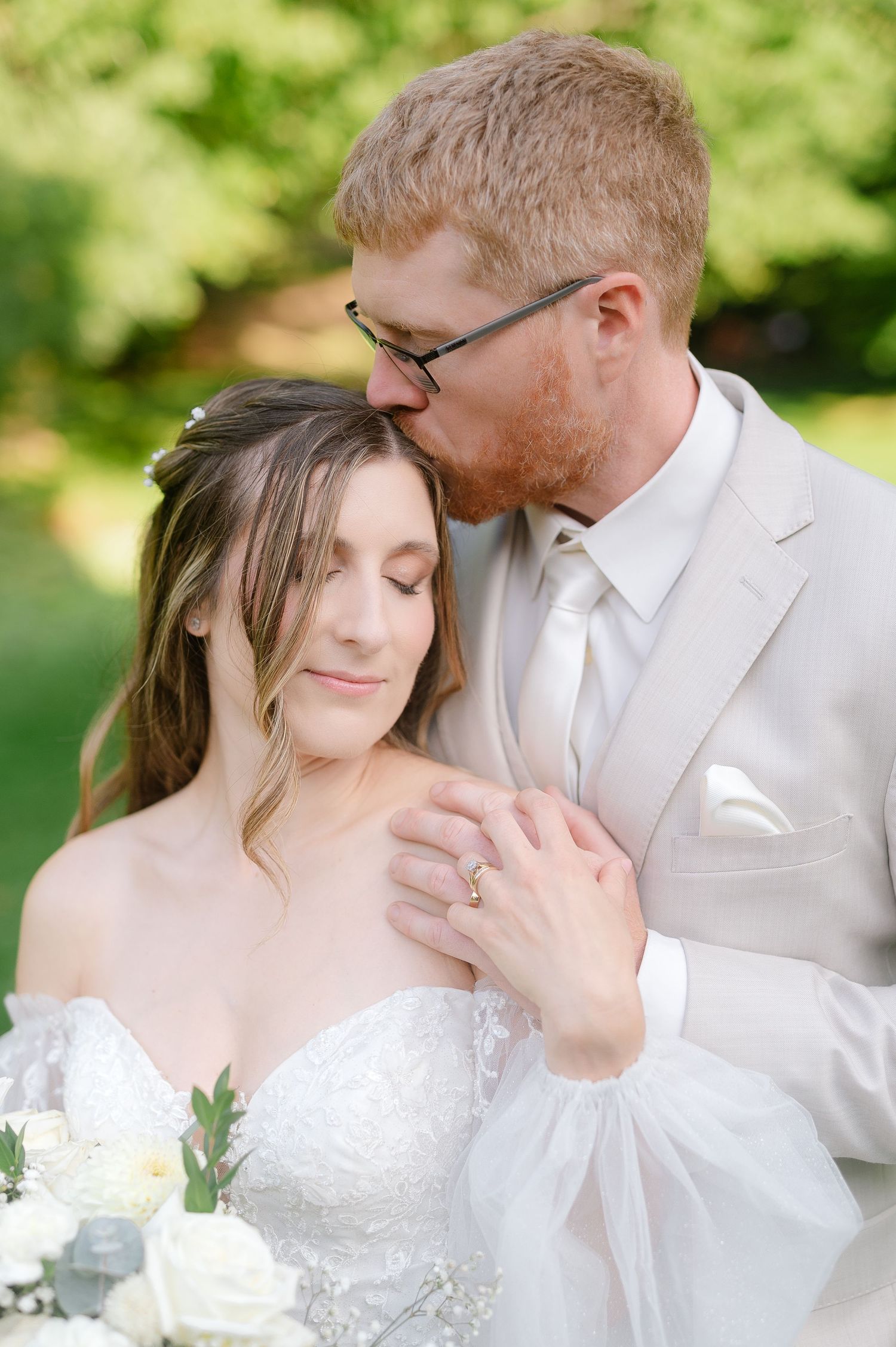 Intimate wedding portraits in a sun-drenched garden setting.