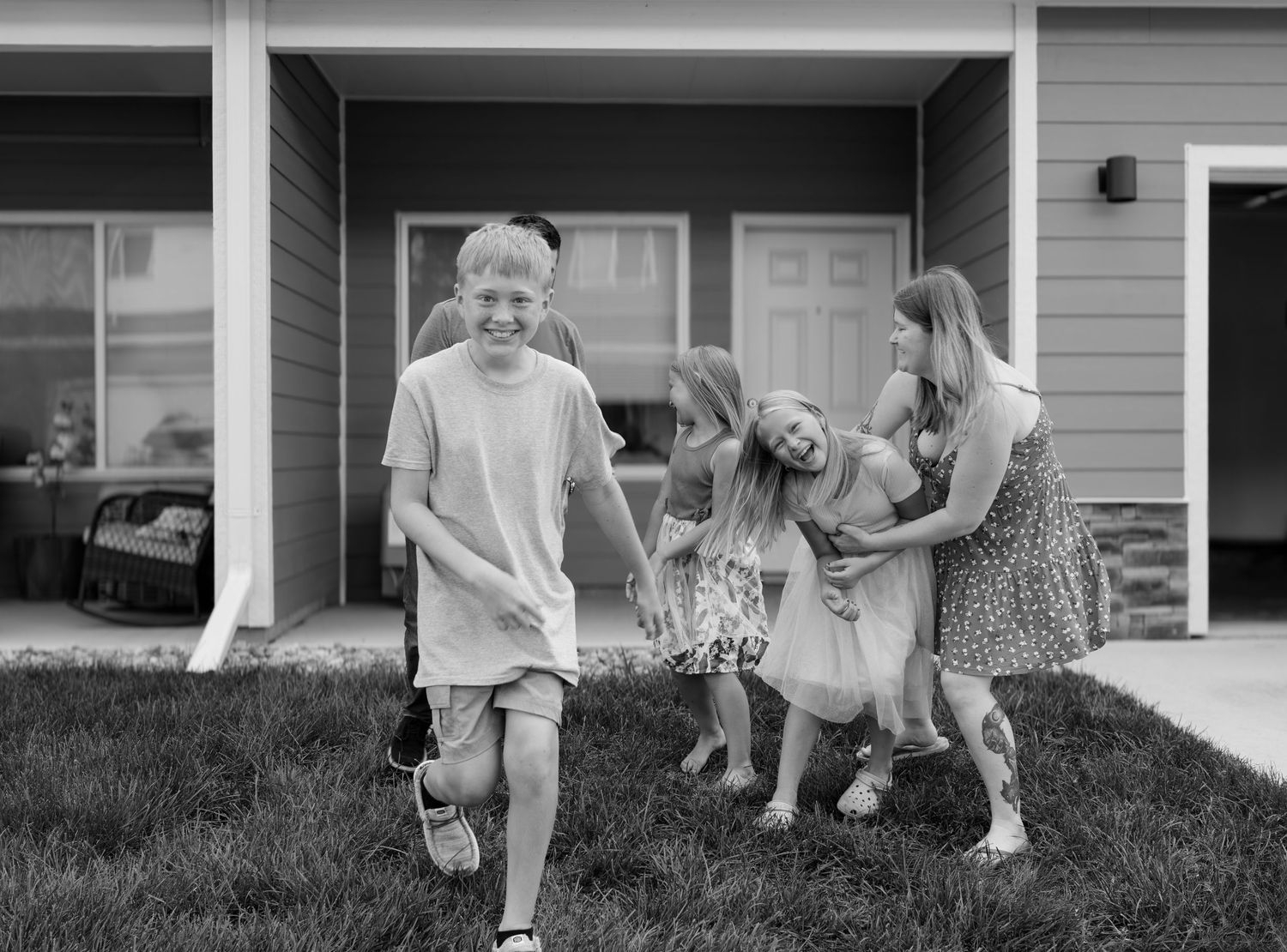 Family portrait outdoors with parents and children, captured by Sioux Falls professional family photographer.