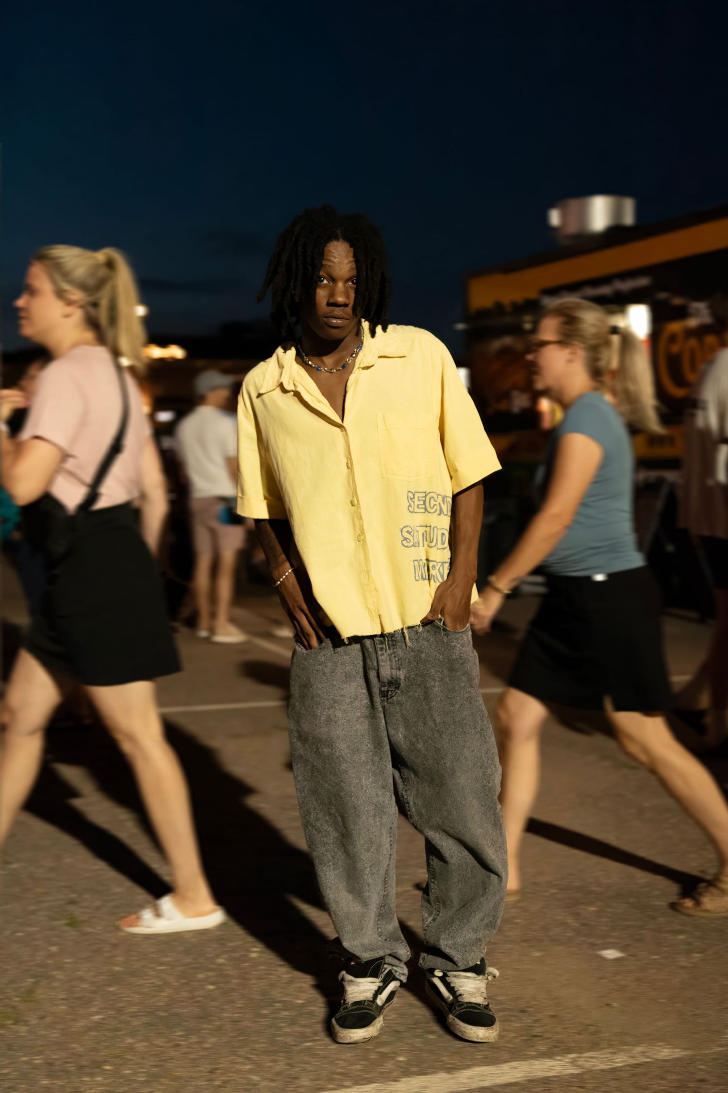 Models showcasing designer clothing at a downtown outdoor fashion event, photographed by local Sioux Falls fashion photographer.