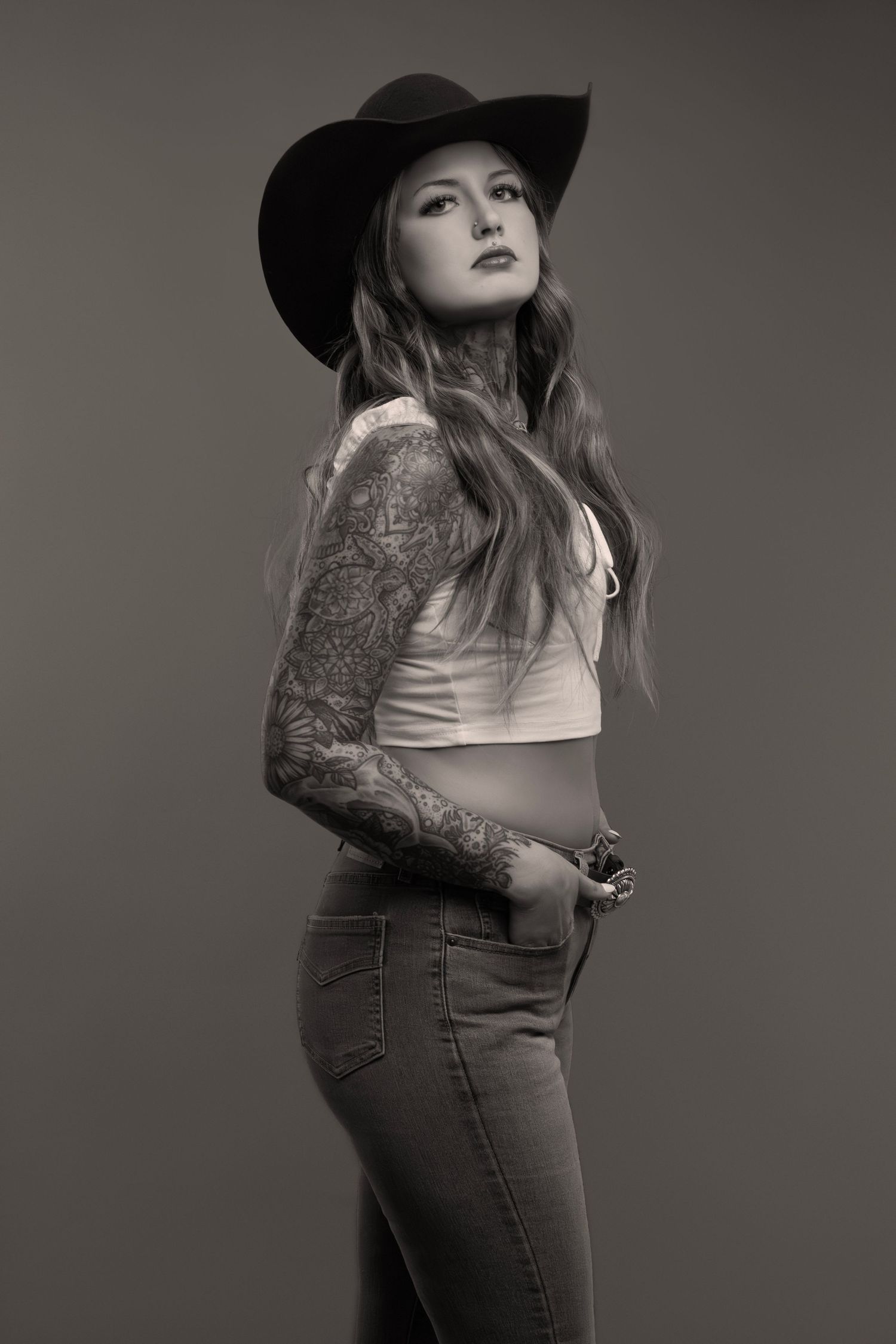 Modern Americana studio portrait with backdrop, Sioux Falls fashionphotographer emphasizing editorial style, fashion, and unique composition