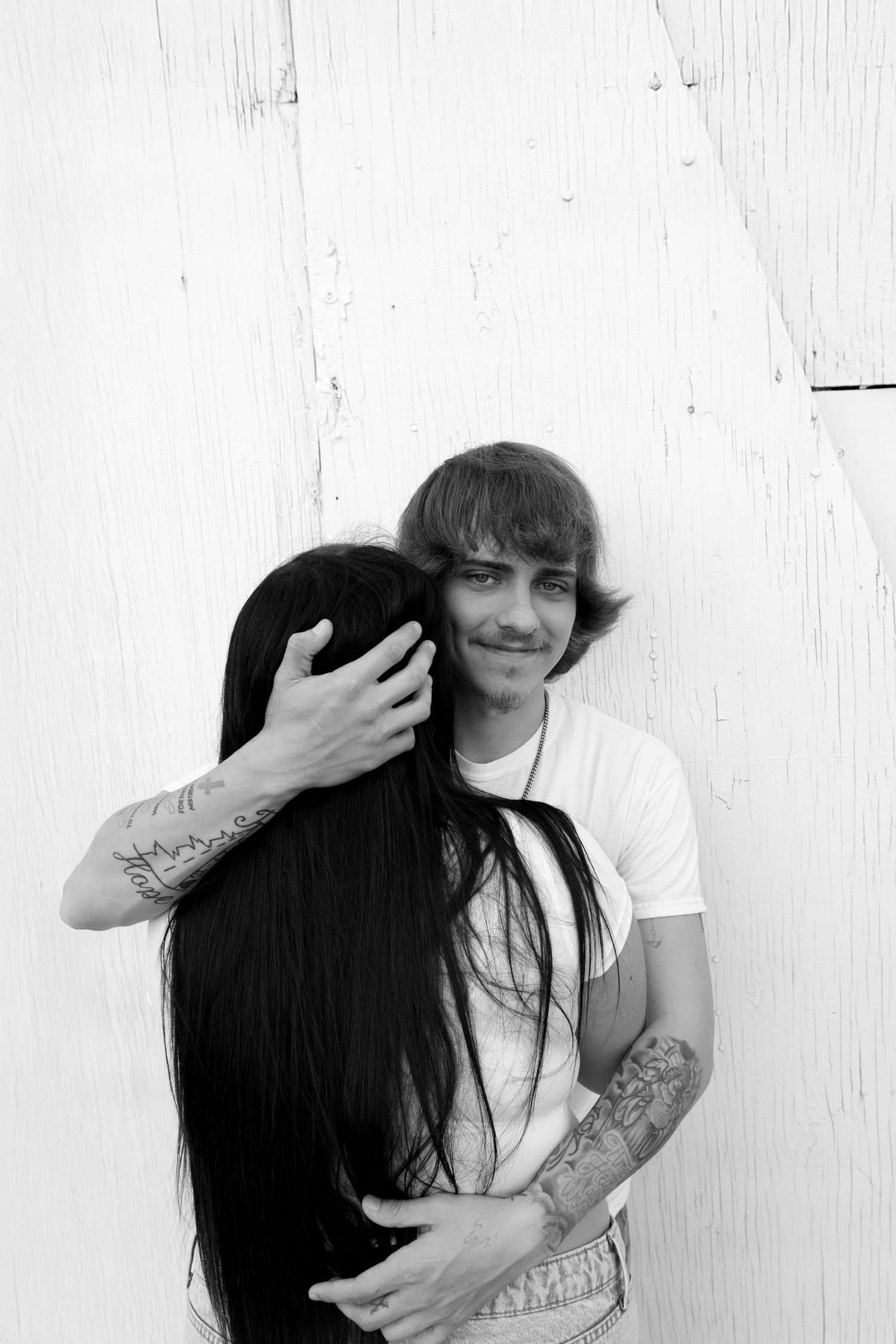Couples Sioux Falls outdoor portrait session, natural light photography highlighting love, candid moments, and lifestyle engagement photos