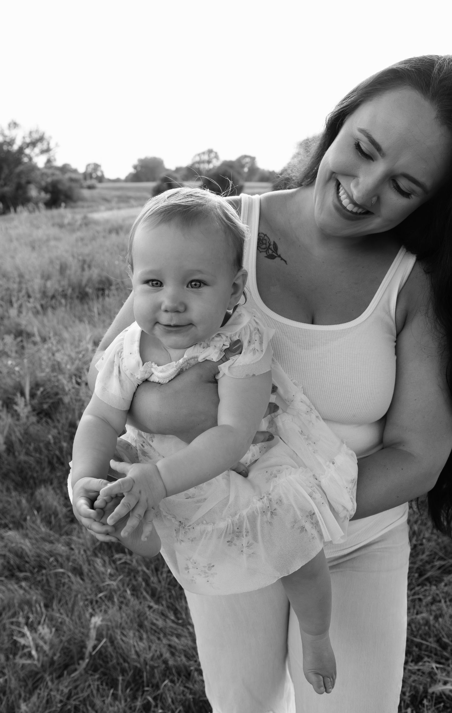 Mother and child sharing a joyful moment, photographed by local professional family photographer, Sixtwentytwo Images in Sioux Falls.