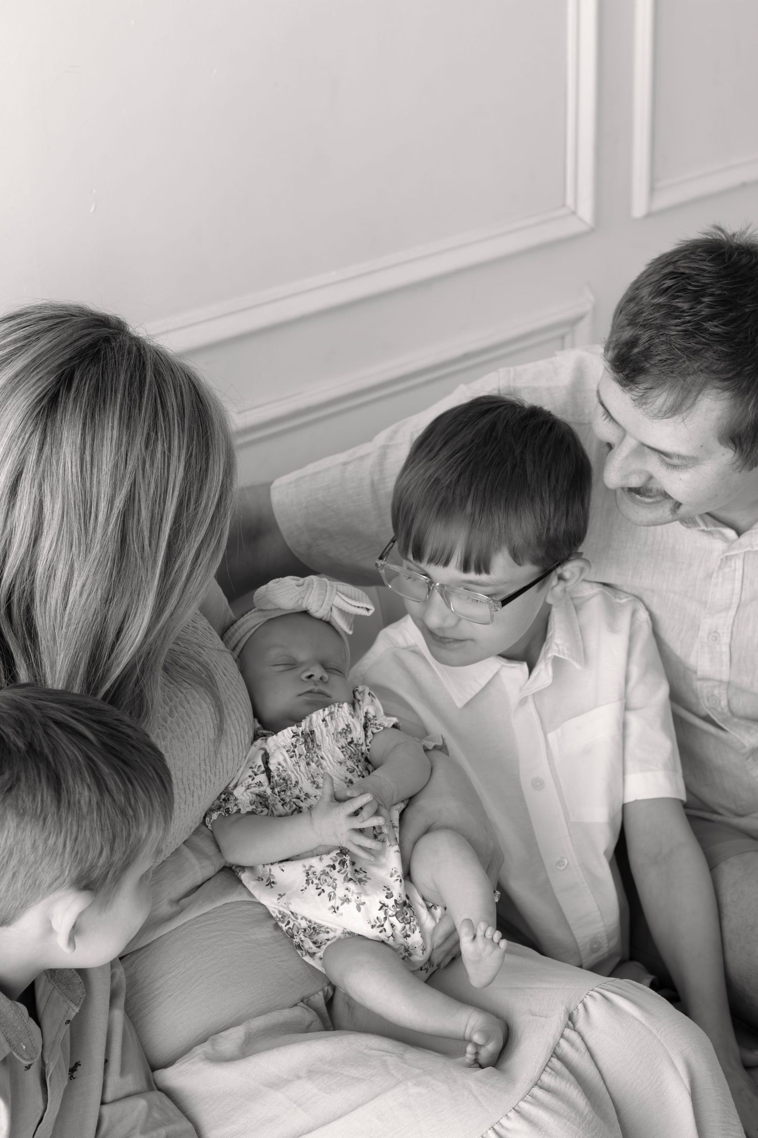 Family enjoying time together in a natural setting, professional photography by local Sioux Falls family photographer.