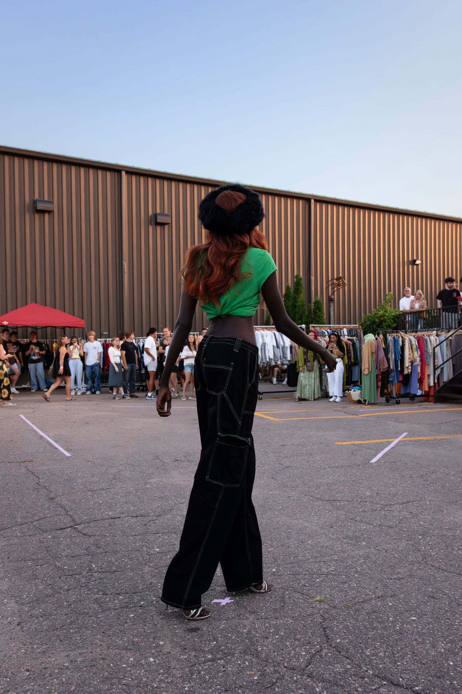 Outdoor runway with models displaying seasonal fashion trends, captured by a skilled fashion photographer in Sioux Falls Second Saturday.