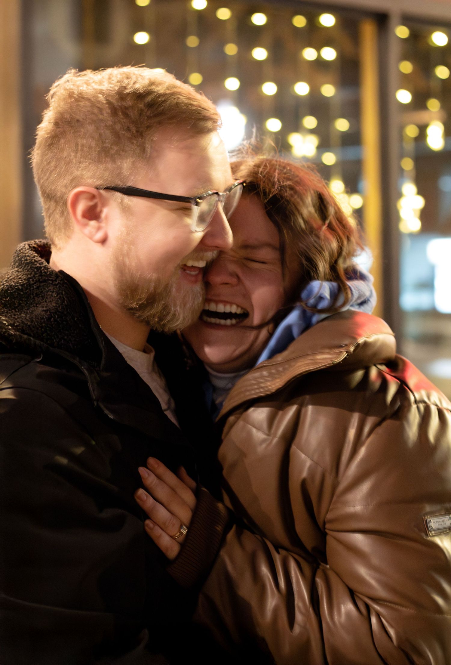 Surprise engagement moment captured outdoors, couple sharing joy and excitement, intimate portrait showcasing love and engagement photograph